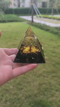 Load and play video in Gallery viewer, OrgoneVivid Tree of Life Orgonite Pyramid for Positive Energy Peridot with Obsidian Quartz
